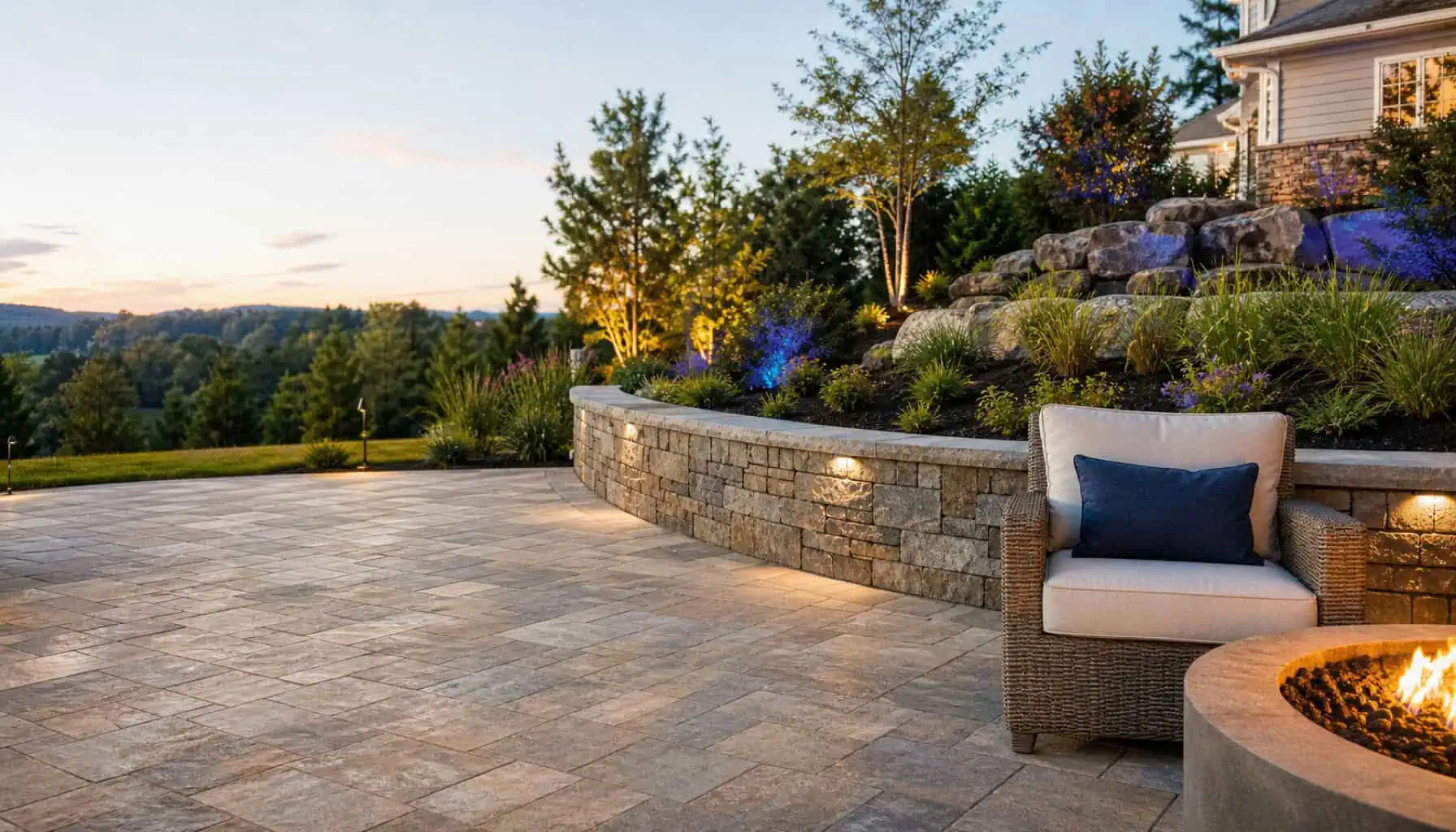 A mason building a stone wall on a landscaping project